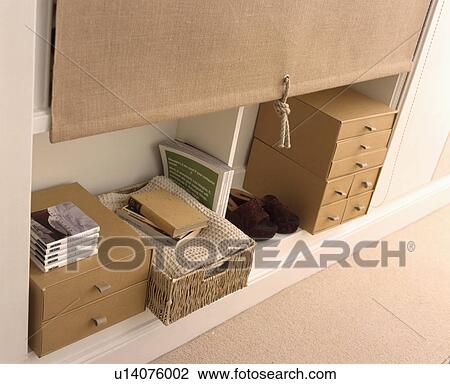 Decorative storage boxes on a white shelf with a hessian blind View Large Photo Image Stock Image - Decorative storage boxes on a white shelf with a hessian blind . Fotosearch