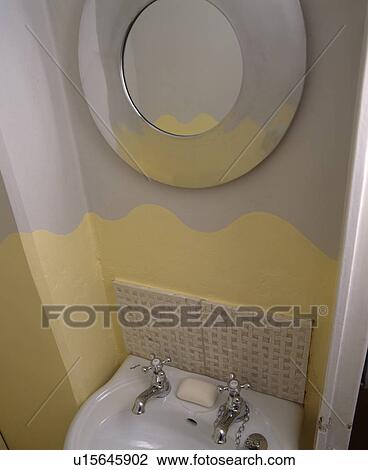 detail of decoration in small yellow and grey painted cloakroom with circular mirror View Large Photo Image Stock Image - detail of decoration in small yellow and grey painted cloakroom with circular mirror. Fotosearch