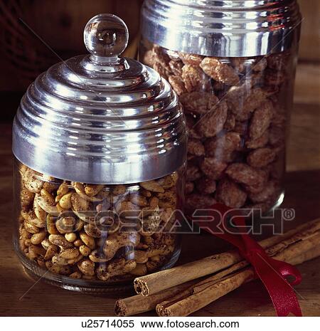 Detail Of Decorative Metal Topped Glass Storage Jars Filled With