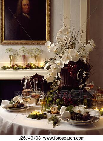 Detail of dining table with large white floral centre piece View Large Photo Image Stock Image - Detail of dining table with large white floral centre piece . Fotosearch