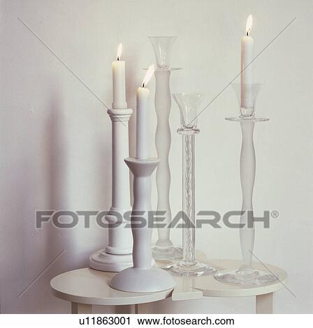 Detail, white candle sticks on white table  View Large Photo Image Stock Image - Detail, white candle sticks on white table . Fotosearch