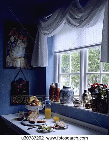Draped white fabric and white blind on kitchen window above fruit juice and bread on worktop View Large Photo Image Stock Image - Draped white fabric and white blind on kitchen window above fruit juice and bread on worktop. Fotosearch