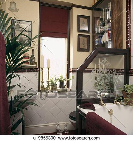 Engraved glass screen seperating toilet and bath in small neutral bathroom with brown blind View Large Photo Image Stock Image - Engraved glass screen seperating toilet and bath in small neutral bathroom with brown blind. Fotosearch
