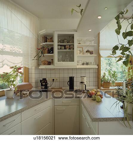 Expresso machine and cafetiere on grey granite worktop in modern white galley kitchen with white lace blind View Large Photo Image Stock Image - Expresso machine and cafetiere on grey granite worktop in modern white galley kitchen with white lace blind. Fotosearch