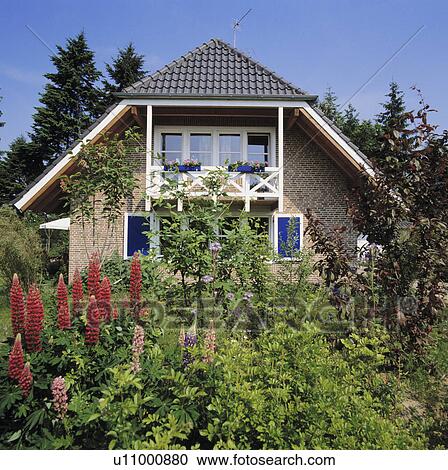 Exterior of modern German suburban house set in mature garden. View Large Photo Image Stock Image - Exterior of modern German suburban house set in mature garden.. Fotosearch