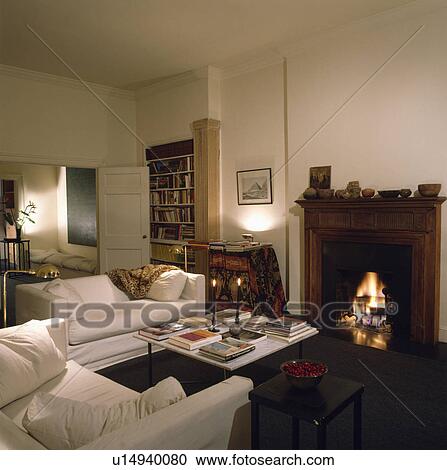 Fireplace and white sofas in modern living room View Large Photo Image Stock Image - Fireplace and white sofas in modern living room. Fotosearch