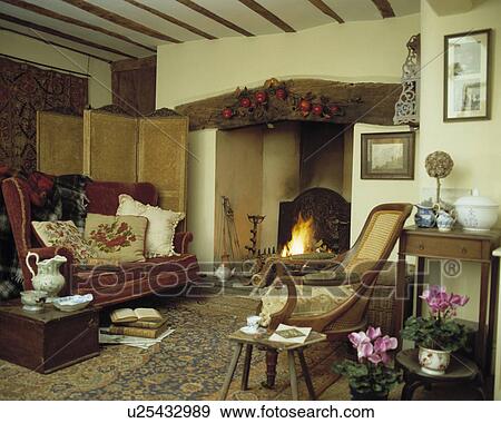 Fireplace in traditional country living room View Large Photo Image Stock Photo - Fireplace in traditional country living room. Fotosearch
