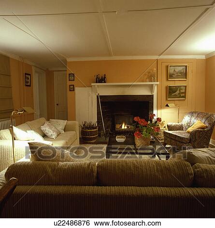 Fireplace in traditional country living room View Large Photo Image Stock Photograph - Fireplace in traditional country living room. Fotosearch