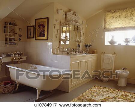 Freestanding roll-toped bath with claw feet - available from stock. View Large Photo Image Stock Photo - Freestanding roll-toped bath with claw feet - available from stock. . Fotosearch
