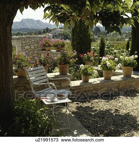 Furniture on patio of house in France View Large Photo Image Stock Image - Furniture on patio of house in France. Fotosearch