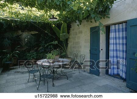 Furniture on patio of house in France View Large Photo Image Stock Photo - Furniture on patio of house in France. Fotosearch