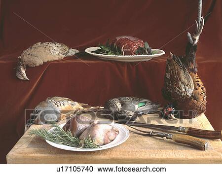 Game birds on wooden chopping board with carving knife and fork View Large Photo Image Stock Image - Game birds on wooden chopping board with carving knife and fork. Fotosearch