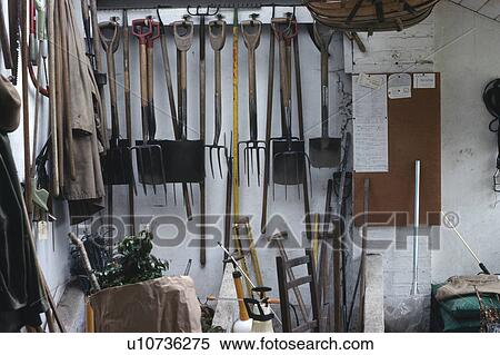 Garden tools stored on pegs in potting shed View Large Photo Image Stock Photography - Garden tools stored on pegs in potting shed. Fotosearch