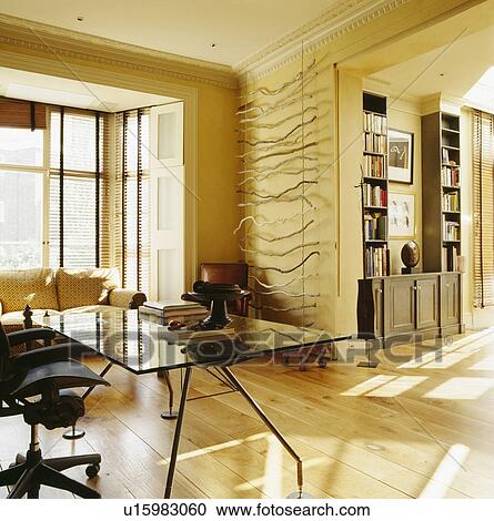 Glass-topped table in modern cream living room View Large Photo Image Stock Image - Glass-topped table in modern cream living room. Fotosearch
