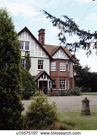 Gravel drive in front of large traditional Edwardian house in the country View Large Photo Image Stock Photo - Gravel drive in front of large traditional Edwardian house in the country. Fotosearch