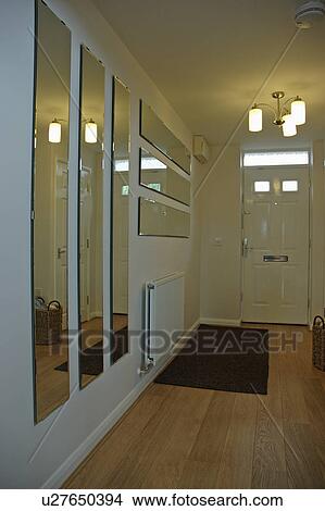 Groups of rectangular mirrors in modern white hall with wooden flooring View Large Photo Image Picture - Groups of rectangular mirrors in modern white hall with wooden flooring. Fotosearch