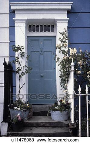 Stock Photo - House Front Door with Plants in Containers. Fotosearch