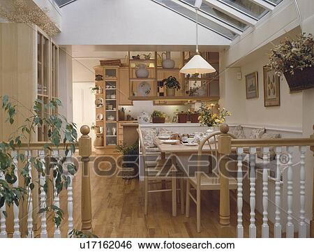 Stock Photograph - Kitchen and dining room in openplan modern extension. Fotosearch