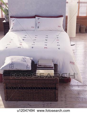 Picture - Large contemporary bedroom with venetian blinds and wooden floor boards . Fotosearch