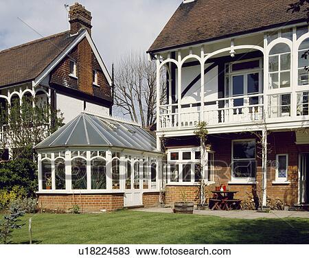 Stock Image - Large Edwardian detached town house with conservatory and balcony. Fotosearch