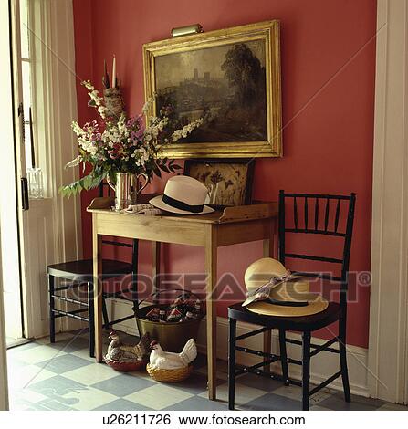 Large Oil Painting Above Old Pine Table In Red Hall With Straw