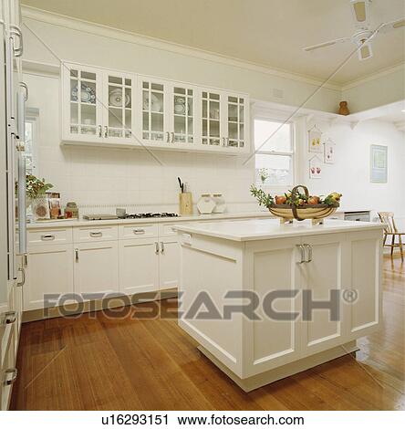 Large white family kitchen with island unit and ceiling fan. View Large Photo Image Stock Image - Large white family kitchen with island unit and ceiling fan.. Fotosearch
