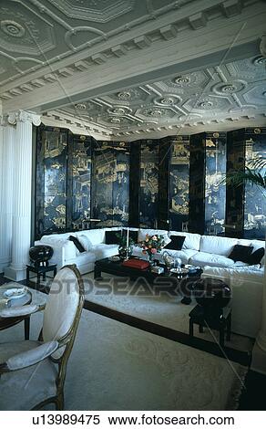 Large white sofa in front of oriental screen in drawing room with ornate ceiling View Large Photo Image Stock Photography - Large white sofa in front of oriental screen in drawing room with ornate ceiling. Fotosearch