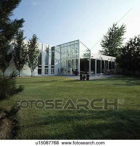 Lawn in front of modern white house in the country View Large Photo Image Stock Photo - Lawn in front of modern white house in the country. Fotosearch
