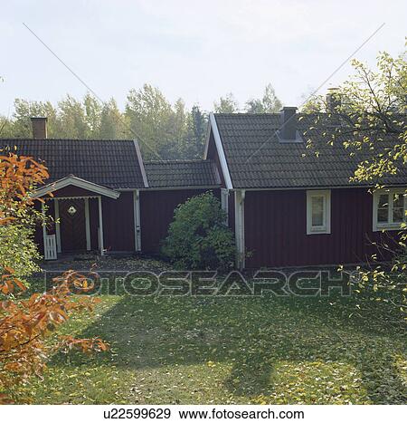 Lawn in front of single-storey wooden cottages View Large Photo Image Stock Photo - Lawn in front of single-storey wooden cottages. Fotosearch
