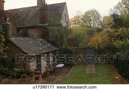 Lawn in small courtyard beside dilapidated country house View Large Photo Image Stock Image - Lawn in small courtyard beside dilapidated country house. Fotosearch