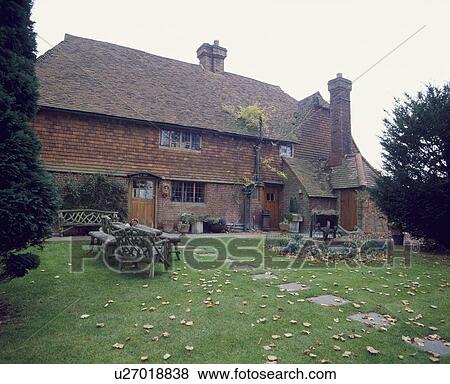 Lawn with paved path to traditional old brick country house View Large Photo Image Stock Photo - Lawn with paved path to traditional old brick country house. Fotosearch