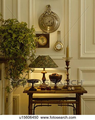 Stock Image - Lighted lamp on table. Fotosearch
