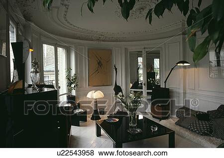 Stock Photo - Lighted lamps in circular white apartment living room. Fotosearch