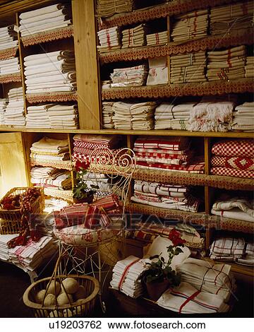 Linen sheets and quilts on wooden shelves View Large Photo Image Stock Image - Linen sheets and quilts on wooden shelves. Fotosearch