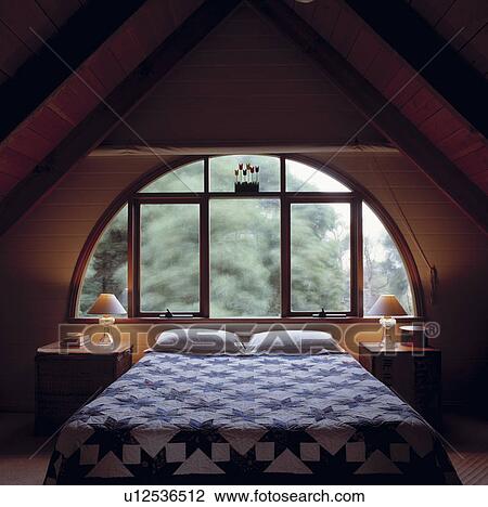 Loft bedroom with curved window and panelled walls and ceiling View Large Photo Image Stock Image - Loft bedroom with curved window and panelled walls and ceiling. Fotosearch