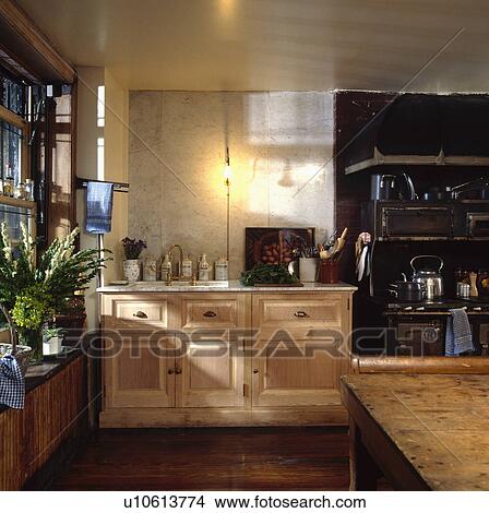 Marble splashback above cupboard in large kitchen View Large Photo Image Picture - Marble splashback above cupboard in large kitchen. Fotosearch