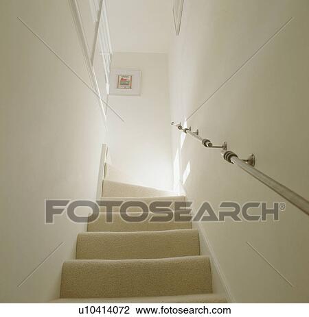 Metal handrail and cream carpet on modern staircase View Large Photo Image Stock Image - Metal handrail and cream carpet on modern staircase. Fotosearch