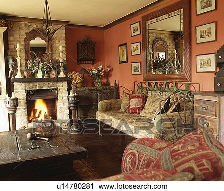 Mirror above fireplace in traditional living room View Large Photo Image Stock Image - Mirror above fireplace in traditional living room. Fotosearch