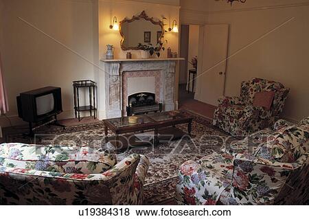 Mirror above fireplace in traditional living room View Large Photo Image Stock Photo - Mirror above fireplace in traditional living room. Fotosearch