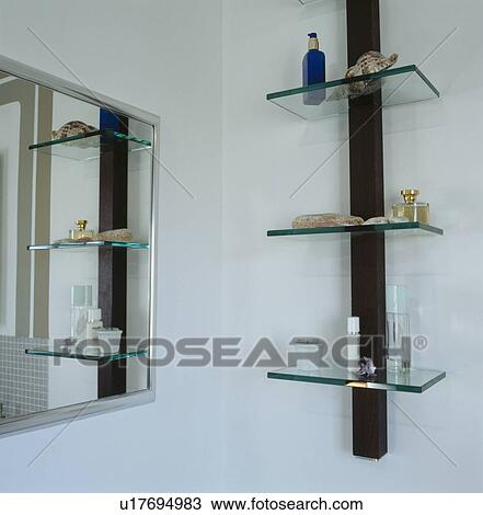 Mirror and glass shelves in modern bathroom View Large Photo Image Stock Image - Mirror and glass shelves in modern bathroom. Fotosearch