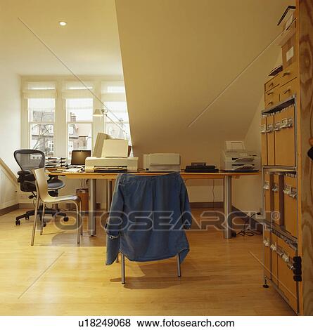 Modern home office in room under the eaves. View Large Photo Image Stock Photo - Modern home office in room under the eaves.. Fotosearch