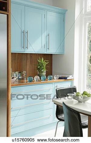Modern pastel blue kitchen with black chairs and white table View Large Photo Image Stock Photography - Modern pastel blue kitchen with black chairs and white table. Fotosearch