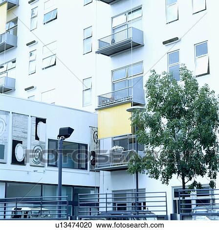 Stock Image - Modern white apartment building in the city of London. Fotosearch