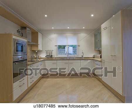 Modern white kitchen with marble floor View Large Photo Image Stock Photography - Modern white kitchen with marble floor. Fotosearch