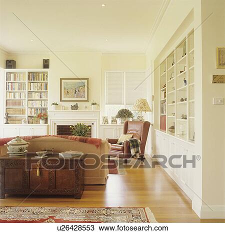 Stock Image - Modern white living room with traditional furniture. Fotosearch