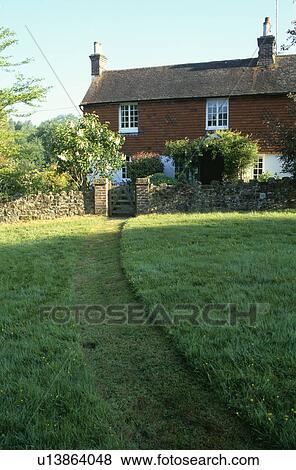 Mown path through grass in front of country cottage View Large Photo Image Stock Photo - Mown path through grass in front of country cottage. Fotosearch