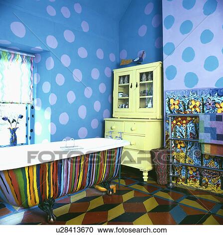 Multi Coloured Painted Bath And Blue Spotted Paint Effect Walls In