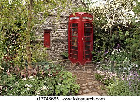 Old red telephone box on in front of wall with red letterbox in country garden View Large Photo Image Stock Photography - Old red telephone box on in front of wall with red letterbox in country garden. Fotosearch
