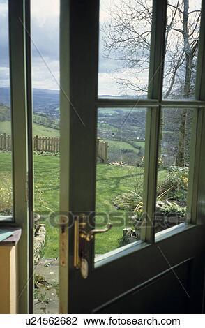 Open half-glazed door with view of countryside View Large Photo Image Stock Image - Open half-glazed door with view of countryside. Fotosearch