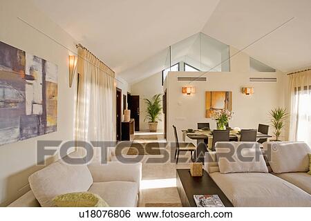 Openplan living and dining room in modern Spanish apartment View Large Photo Image Stock Photograph - Openplan living and dining room in modern Spanish apartment. Fotosearch